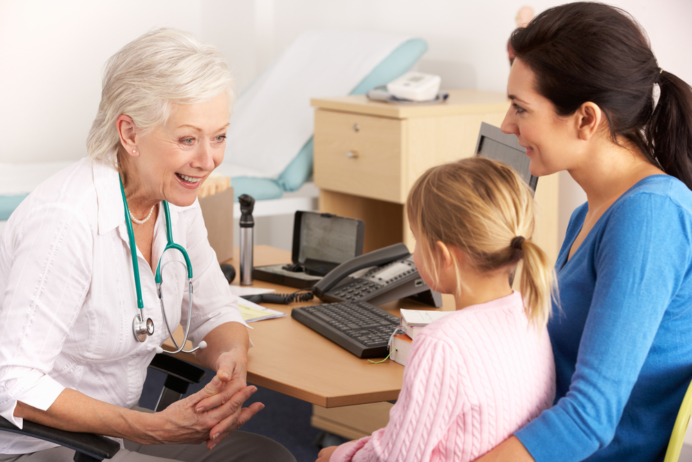 British,Gp,Talking,To,Young,Child,And,Mother
