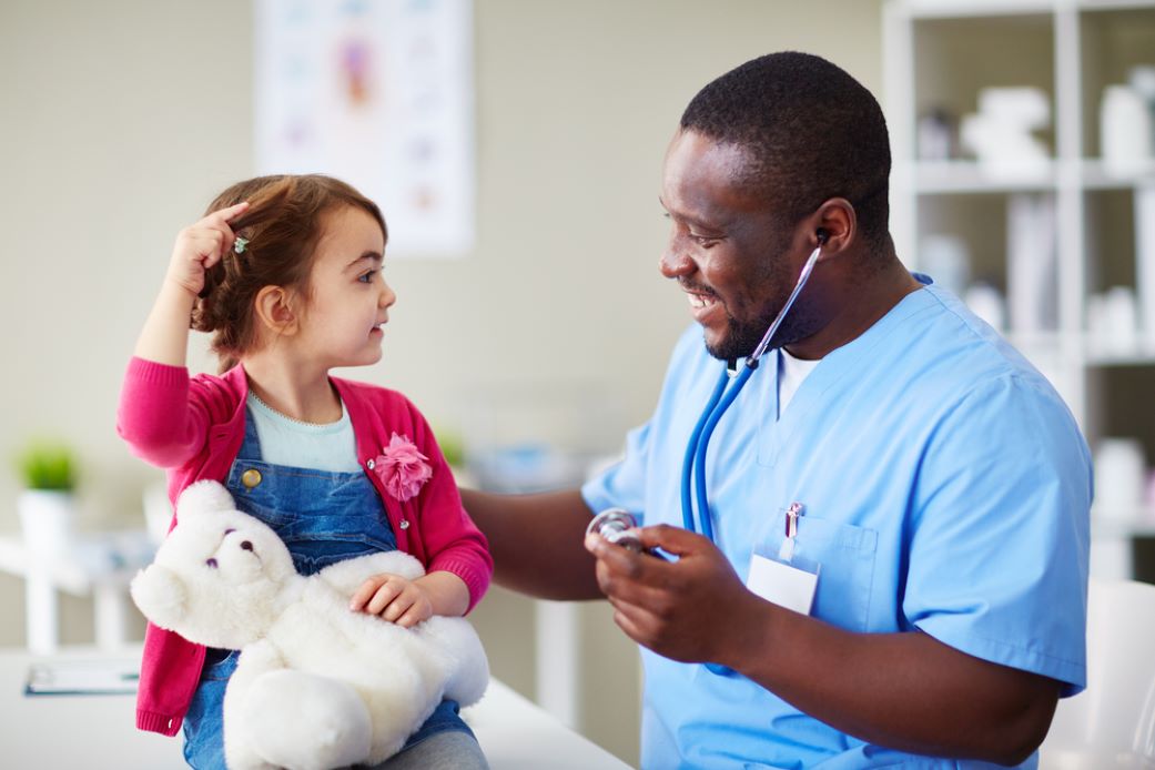 Male nurse about to examine a young girl