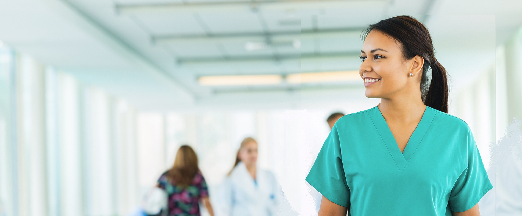 Smiling Nurse in hospital corridor