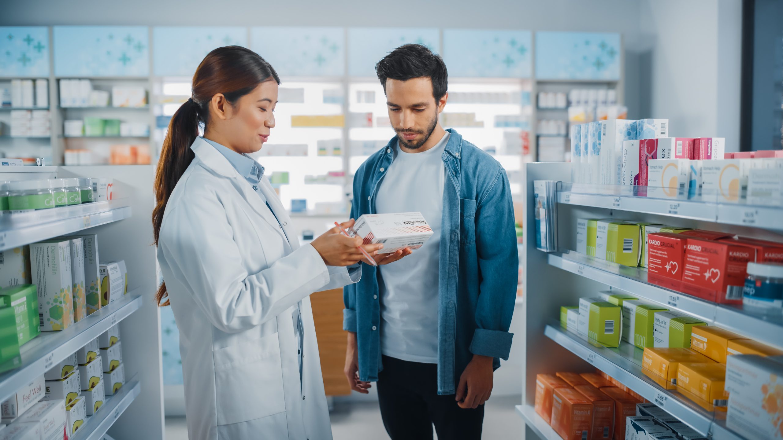 Female pharmacist with customer