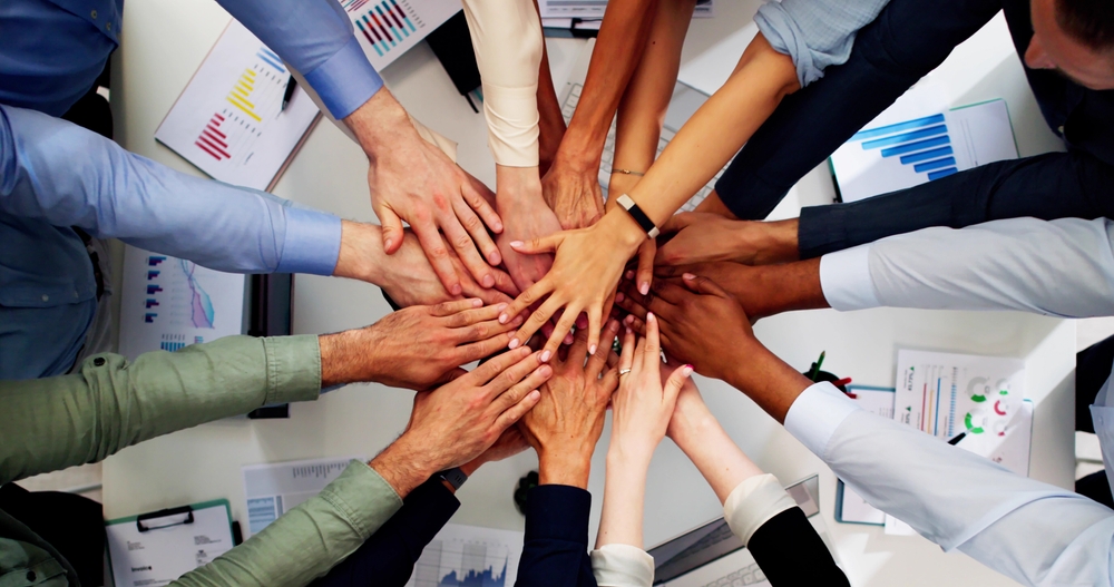 Hands together showing collaboration between different disciplines