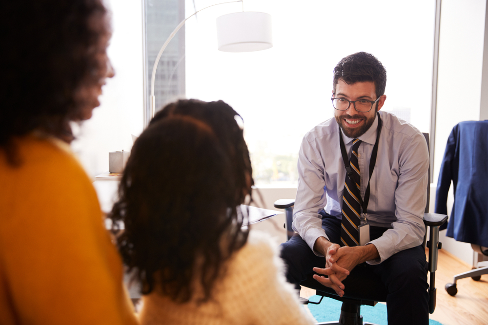 Children Disability Network Manager interacting with family