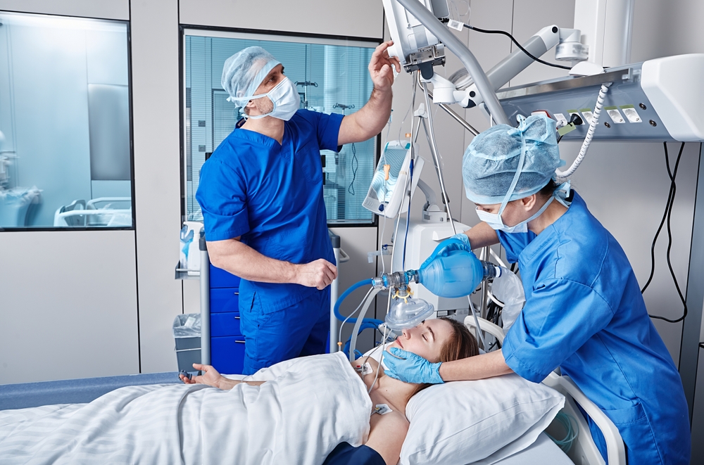 Medical Professionals assisting a patient with a ventilator